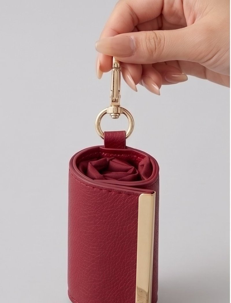 Folded pouch hanging from a finger